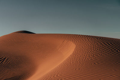 Scenic view of desert against clear sky