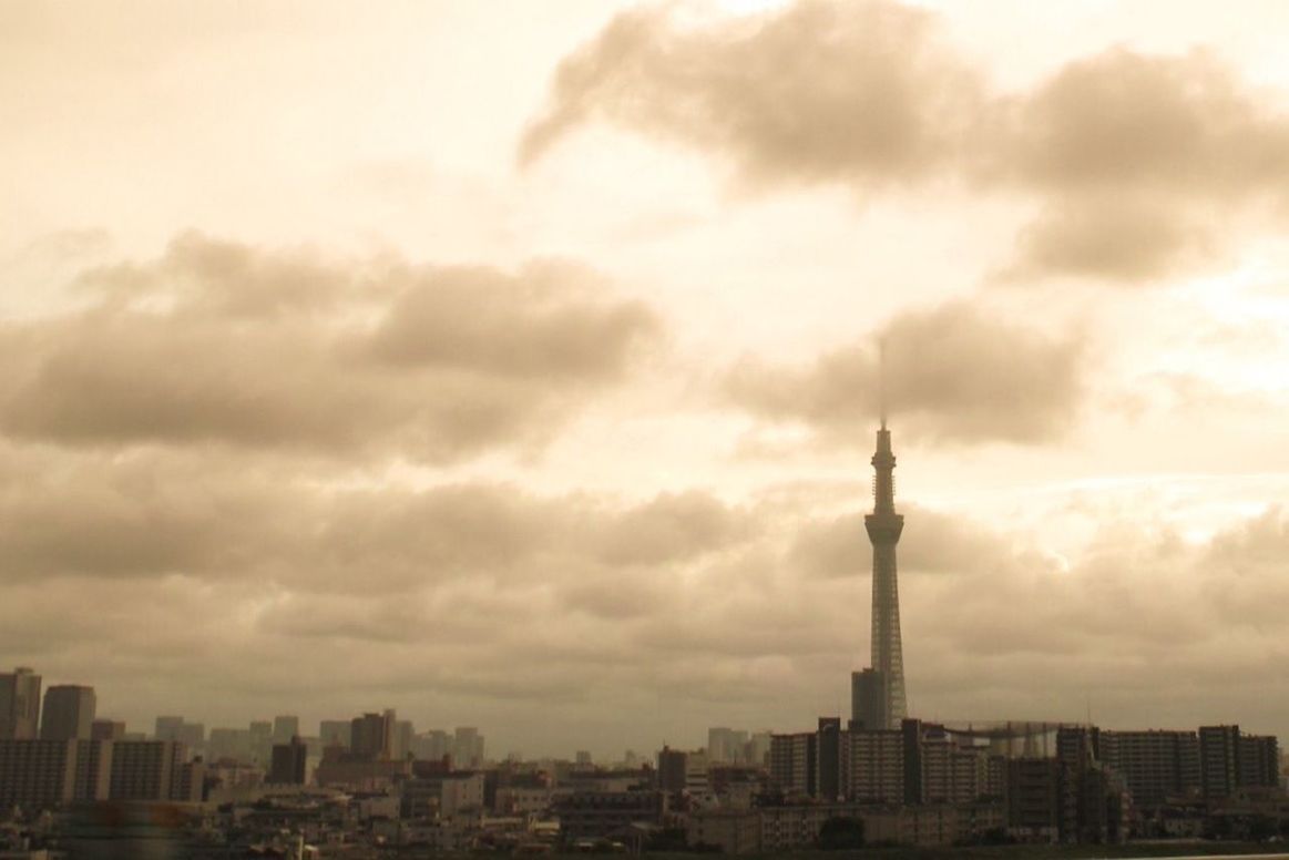 DIRECTLY ABOVE SHOT OF CITYSCAPE AGAINST CLOUDY SKY