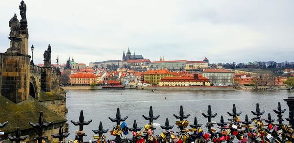 Panoramic view of river and buildings against sky