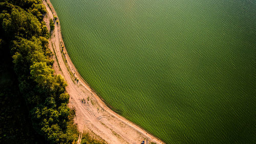 High angle view of beach along calm sea