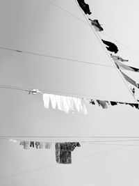 Low angle view of cables against clear sky