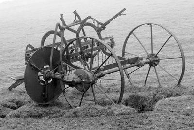 Rusty wheel on field