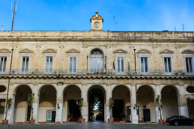 Facade of historic building against blue sky