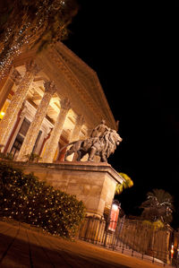 Low angle view of statue at night