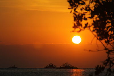 Scenic view of sea against romantic sky at sunset