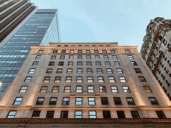 Low angle view of modern building in city against sky