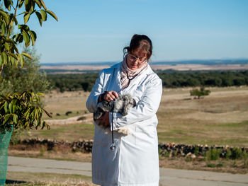 Doctor examining rabbit with stethoscope