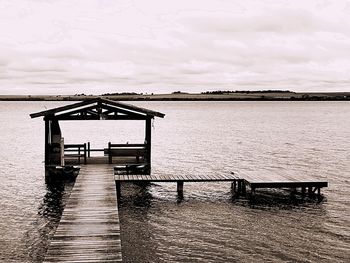 Pier over sea against sky