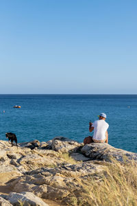 Scenic view of sea against clear blue sky