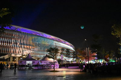 Illuminated building against sky at night