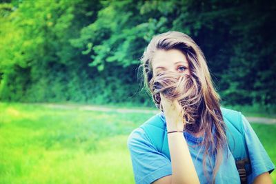 Woman standing on grassy field