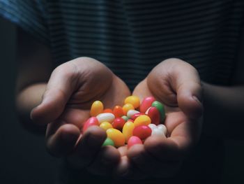 Close-up of cropped hand holding food