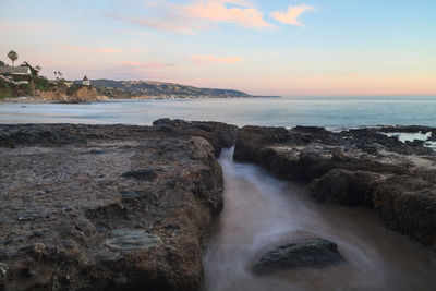 Scenic view of sea against sky at sunset