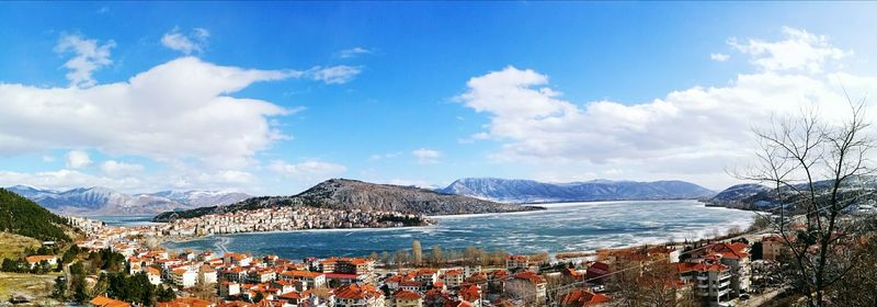 Panoramic view of beach against cloudy sky