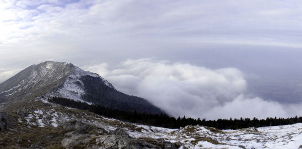 Scenic view of snowcapped mountains against sky