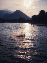 Scenic view of lake against sky during sunset