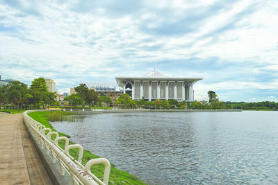 View of bridge over river against cloudy sky