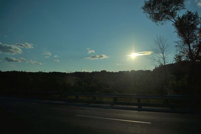 Scenic view of trees against sky during sunset