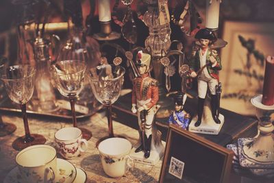 High angle view of toy soldiers amidst cups and glass at store