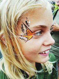 Close-up of girl with face paint on eyesight