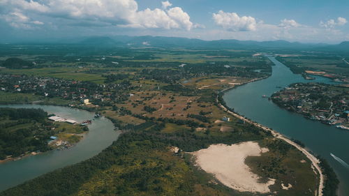 High angle view of river amidst landscape against sky