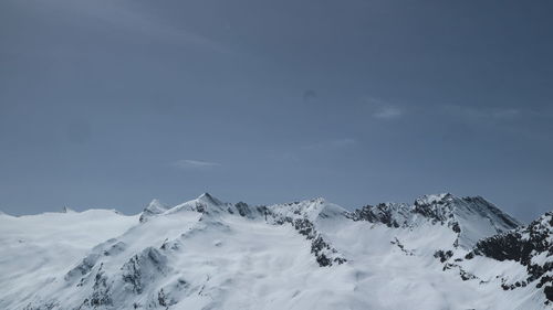Snow covered mountains against sky