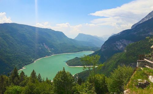 Panoramic view of trees and mountains against sky