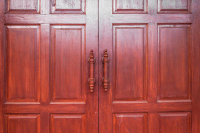 Full frame shot of closed wooden door of building