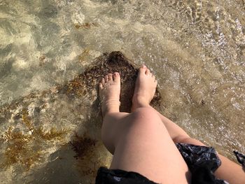 Low section of woman at beach