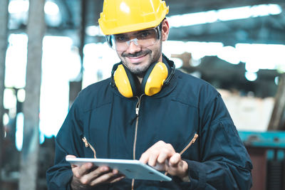 Portrait of man working with mobile phone