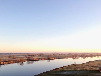 Panoramic view of river and city against clear sky