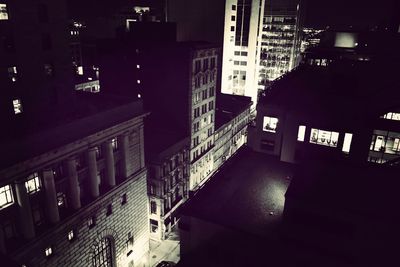 Modern buildings in city at night