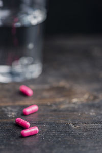 Close-up of pink juice on table