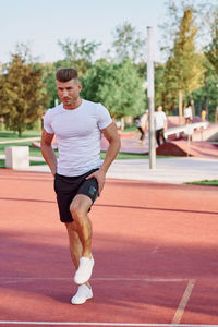 Full length of young man looking at camera