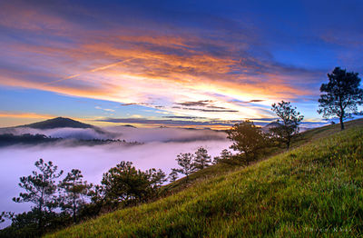 Scenic view of lake against sky during sunset