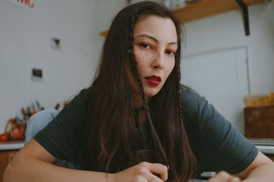 Young beautiful woman with the smartphone at home