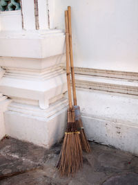 High angle view of broom against wall outdoors