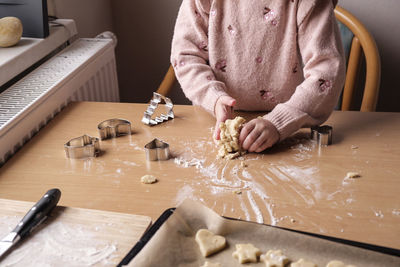 Midsection of chef preparing food on table