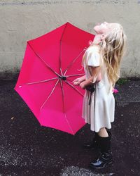 Full length of girl with umbrella