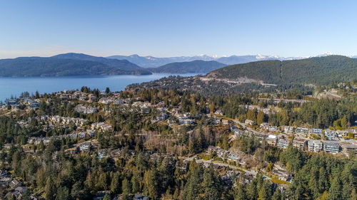 Scenic view of trees and mountains against sky