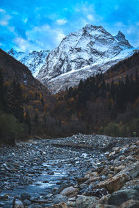 Scenic view of snowcapped mountains against sky