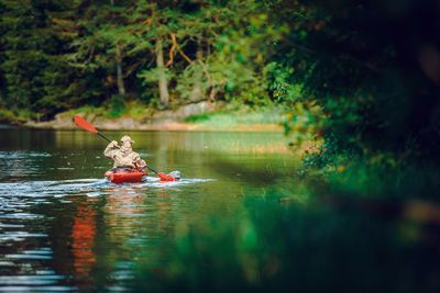 Man rowing boat in lake