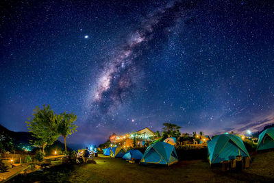 Scenic view of illuminated fireworks against sky at night