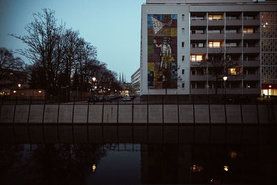 Illuminated city against sky at night
