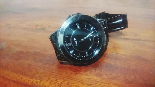 High angle view of clock on table