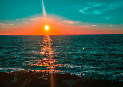 Scenic view of sea against sky during sunset