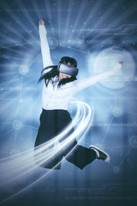 Digital composite image of businesswoman in virtual reality simulator jumping against connecting dots