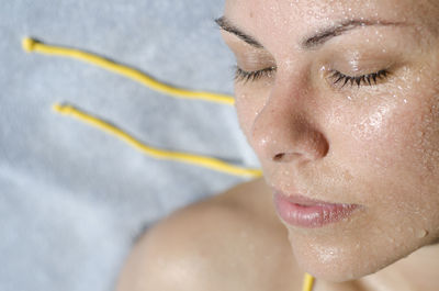 Close-up of young woman in swimming pool