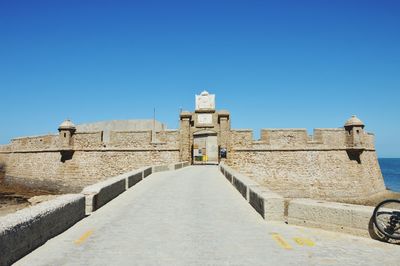 Low angle view of fort against blue sky