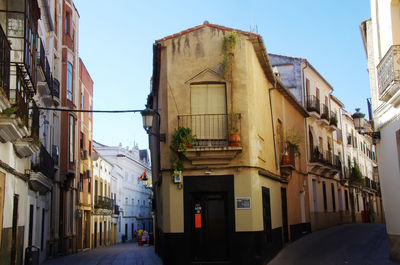 Narrow street amidst buildings in city